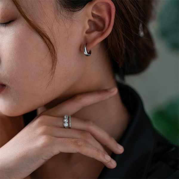 French retro matte lava texture spiral earrings with a niche high-end feel, light luxury and exquisite antique silver needles Earrings for women